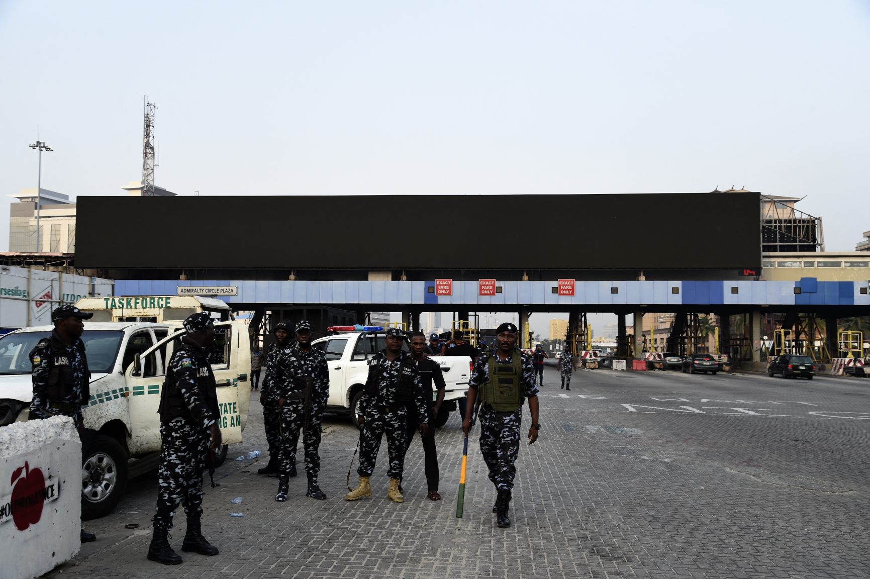 Nigerian policemen man a tollgate at Lekki district in Lagos on February 13, 2021 after activists called protests demanding justice for victims of a deadly shooting during demonstrations last year.