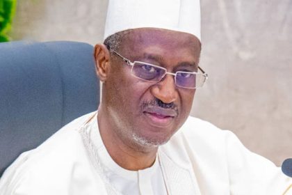 a man in a white hat and glasses
